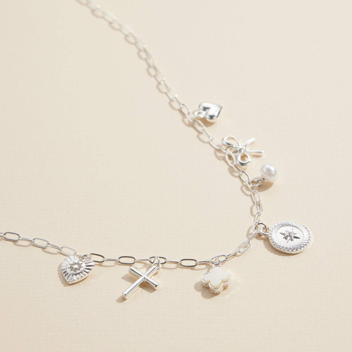 Charm Necklace with Heart, Cross, Compass Pearl, and Bow Pendants